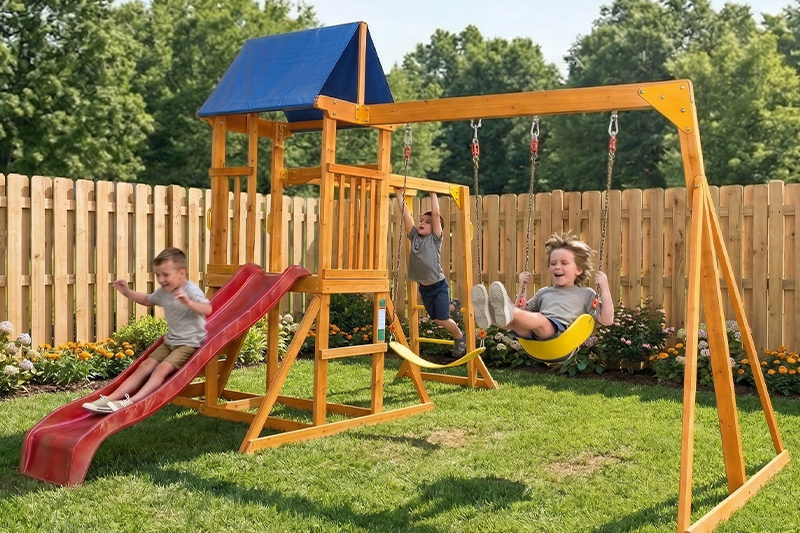 Wooden backyard playground swing set with slide, monkey bars, and rock wall for kids ages 3-6