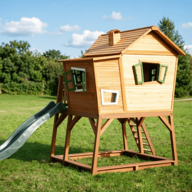 Whimsical Raised Wooden Playhouse with Slide | Custom Kids Backyard Treehouse Factory